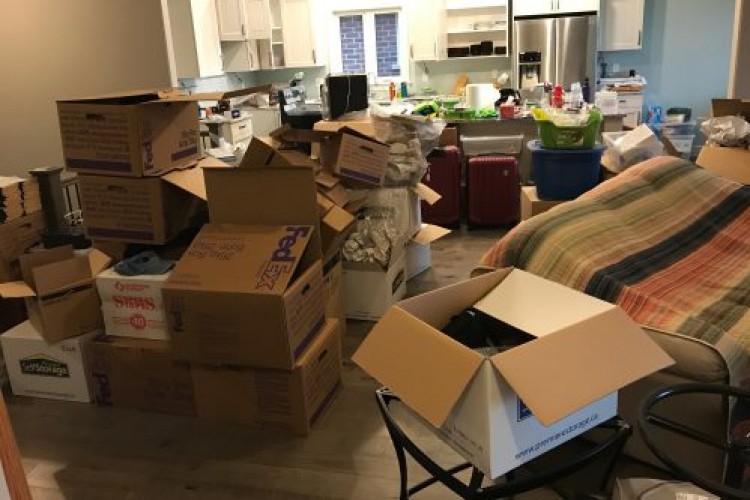 living room filled with moving boxes