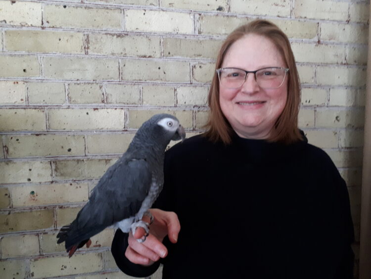 Author Joanne Levy and her African Grey parrot, Gabby
